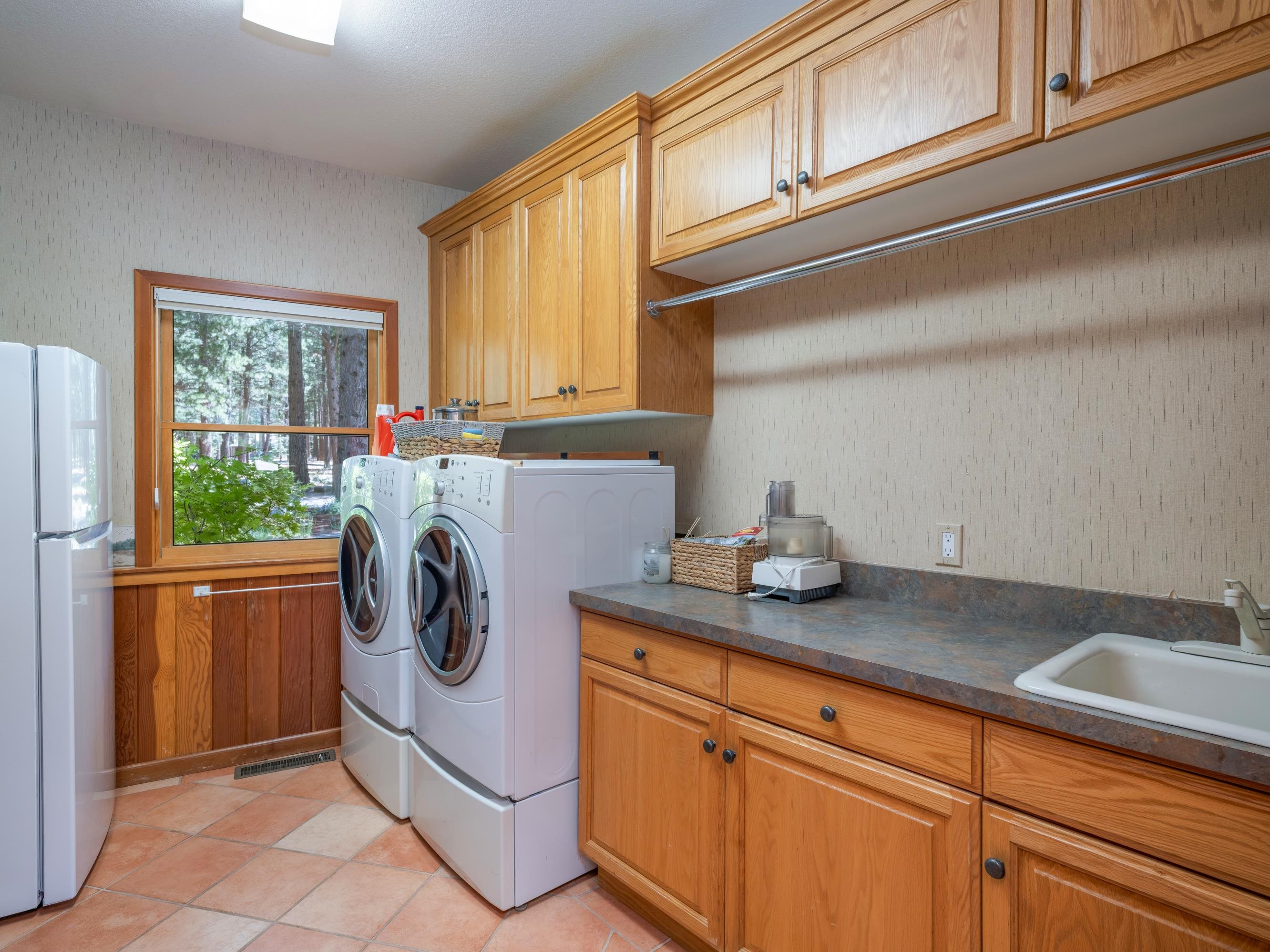 134 Quail View Circle Clio, CA 96106 - Photo 29 of 49 a utility room with sink dryer and washer