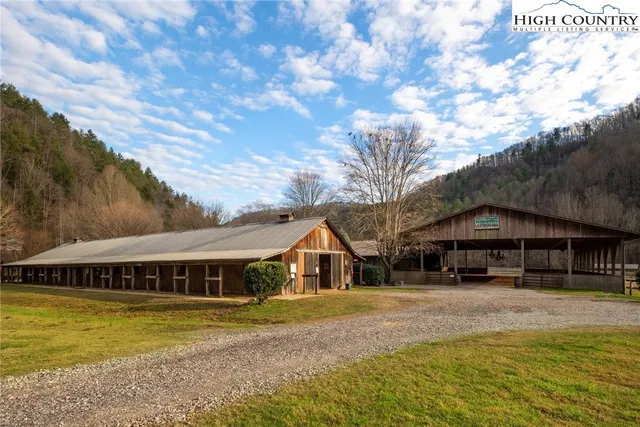 a view of a swimming pool with a yard