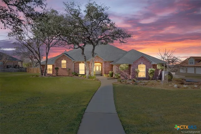 a house view with swimming pool and trees in the background
