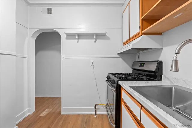 a kitchen with a stove and a refrigerator
