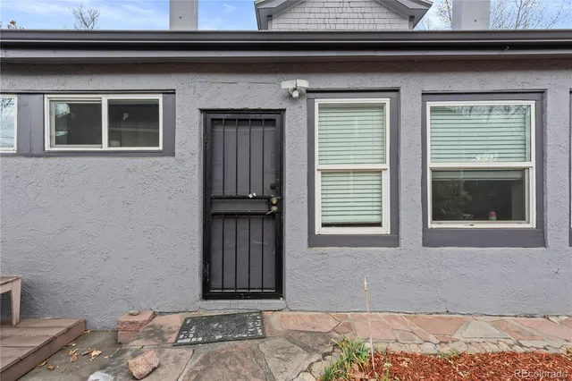 a front view of a house with a wooden floor and a window