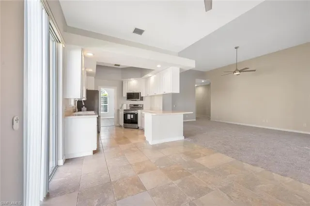 a kitchen with a sink stove and refrigerator