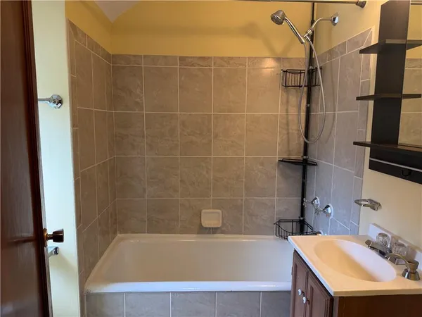 a bathroom with a sink and a bathtub