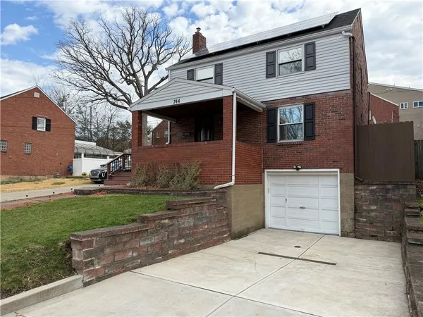 a view of a house with a back yard