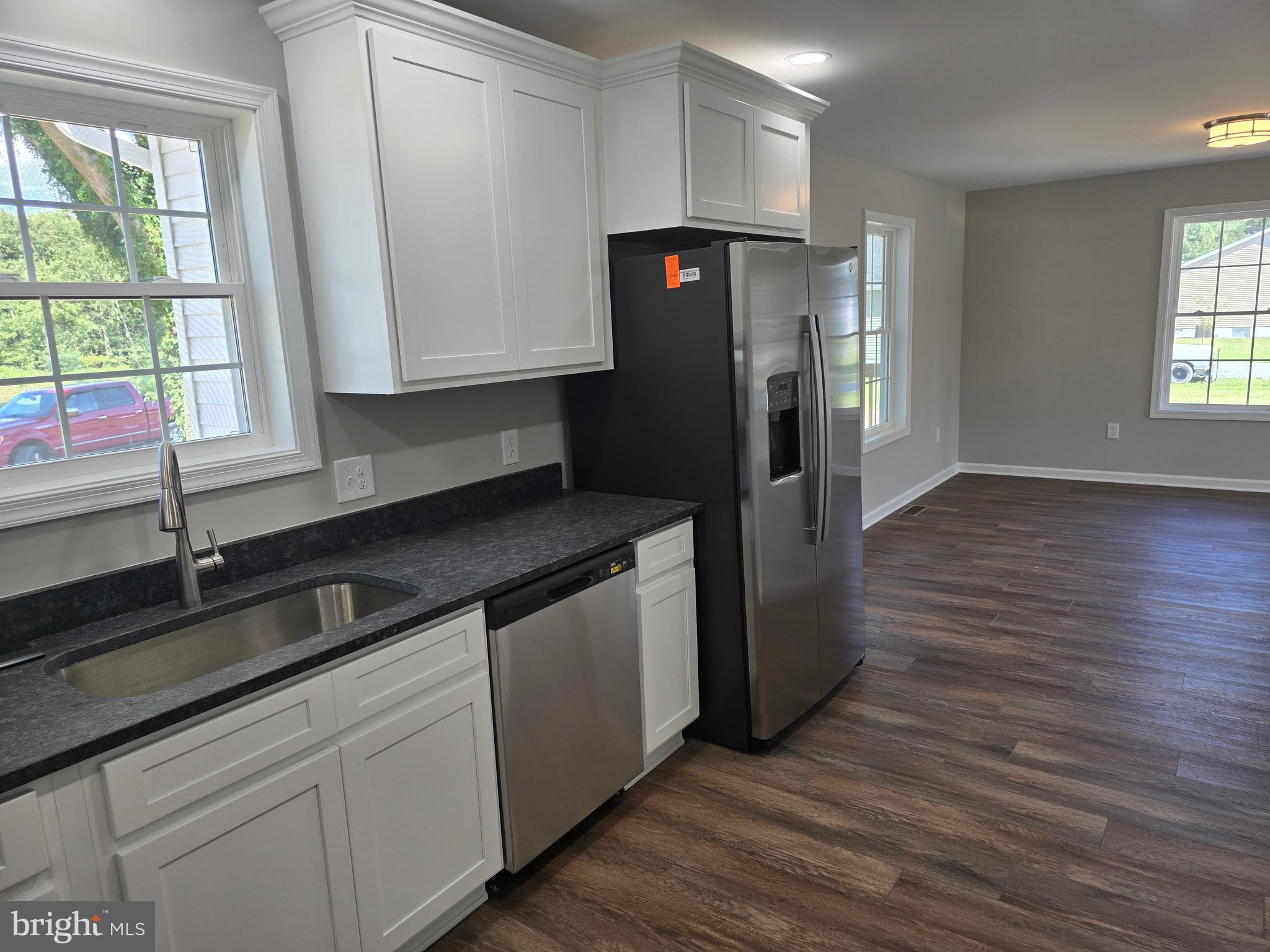 7457 Market Street Willards, MD 21874 - Photo 21 of 51 a kitchen with a refrigerator and a sink