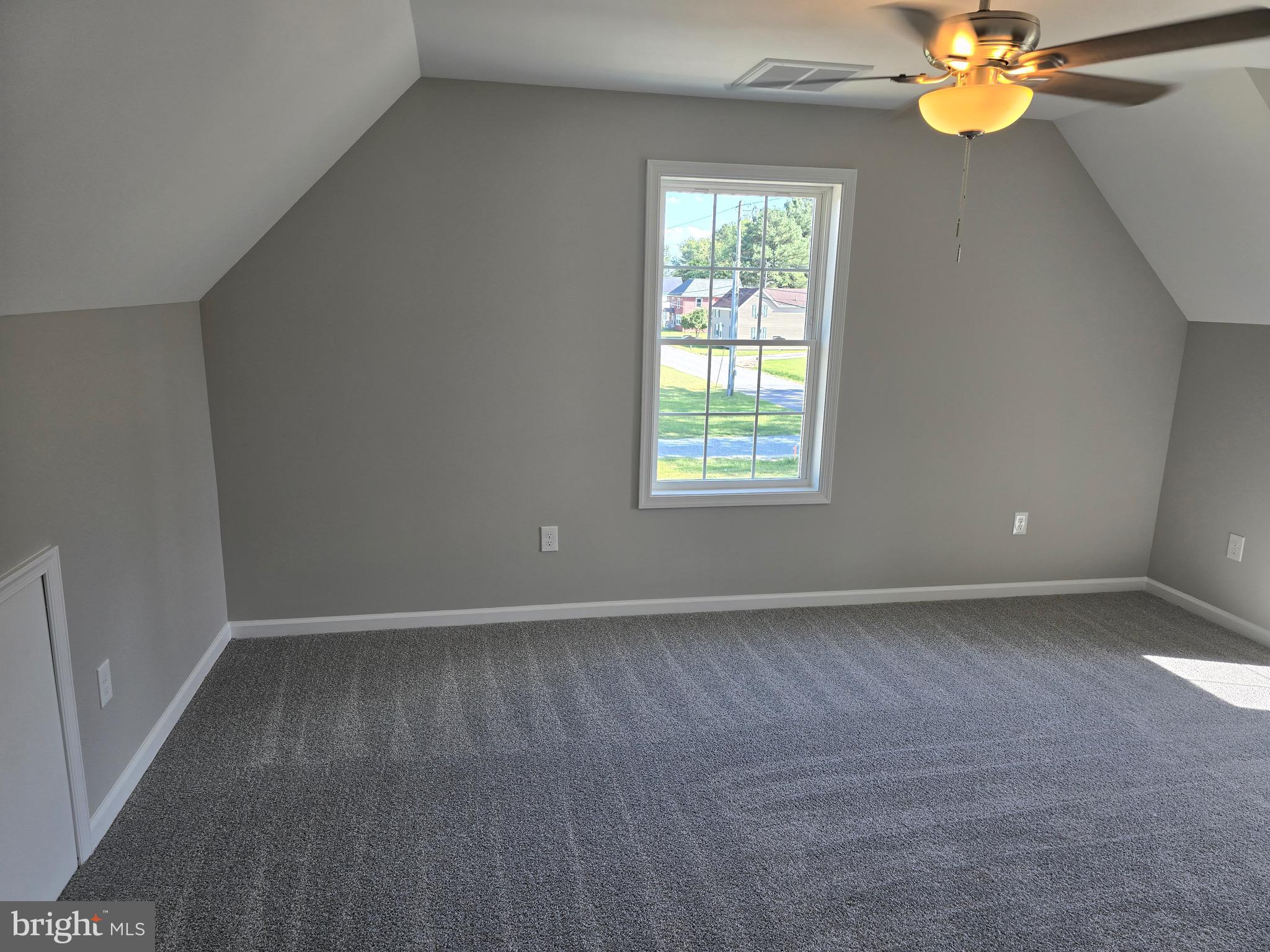 7457 Market Street Willards, MD 21874 - Photo 40 of 51 an empty room with window and chandelier fan