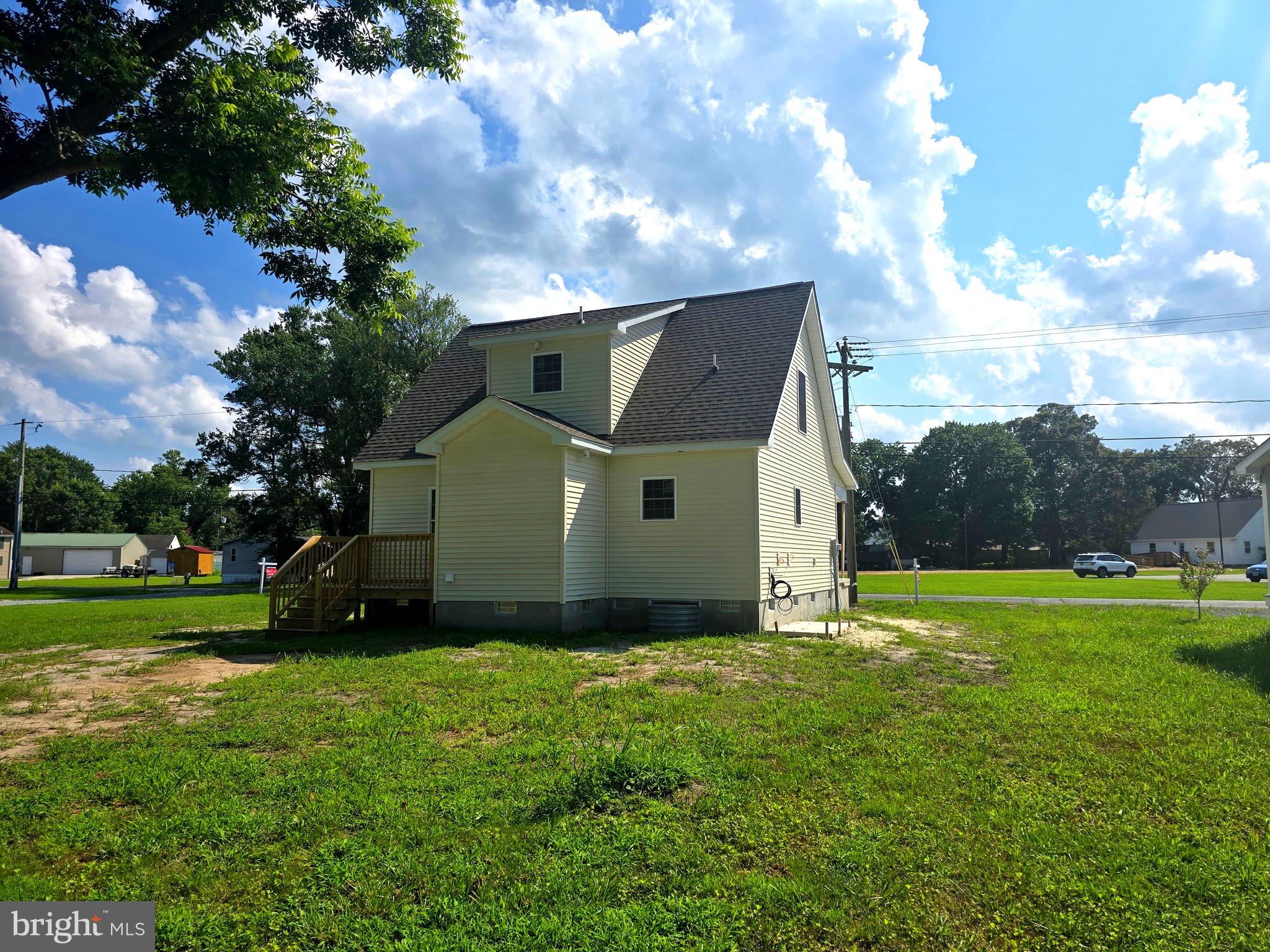 7457 Market Street Willards, MD 21874 - Photo 4 of 51 a view of a house with a big yard and a large tree