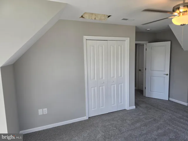 an empty room with closet area