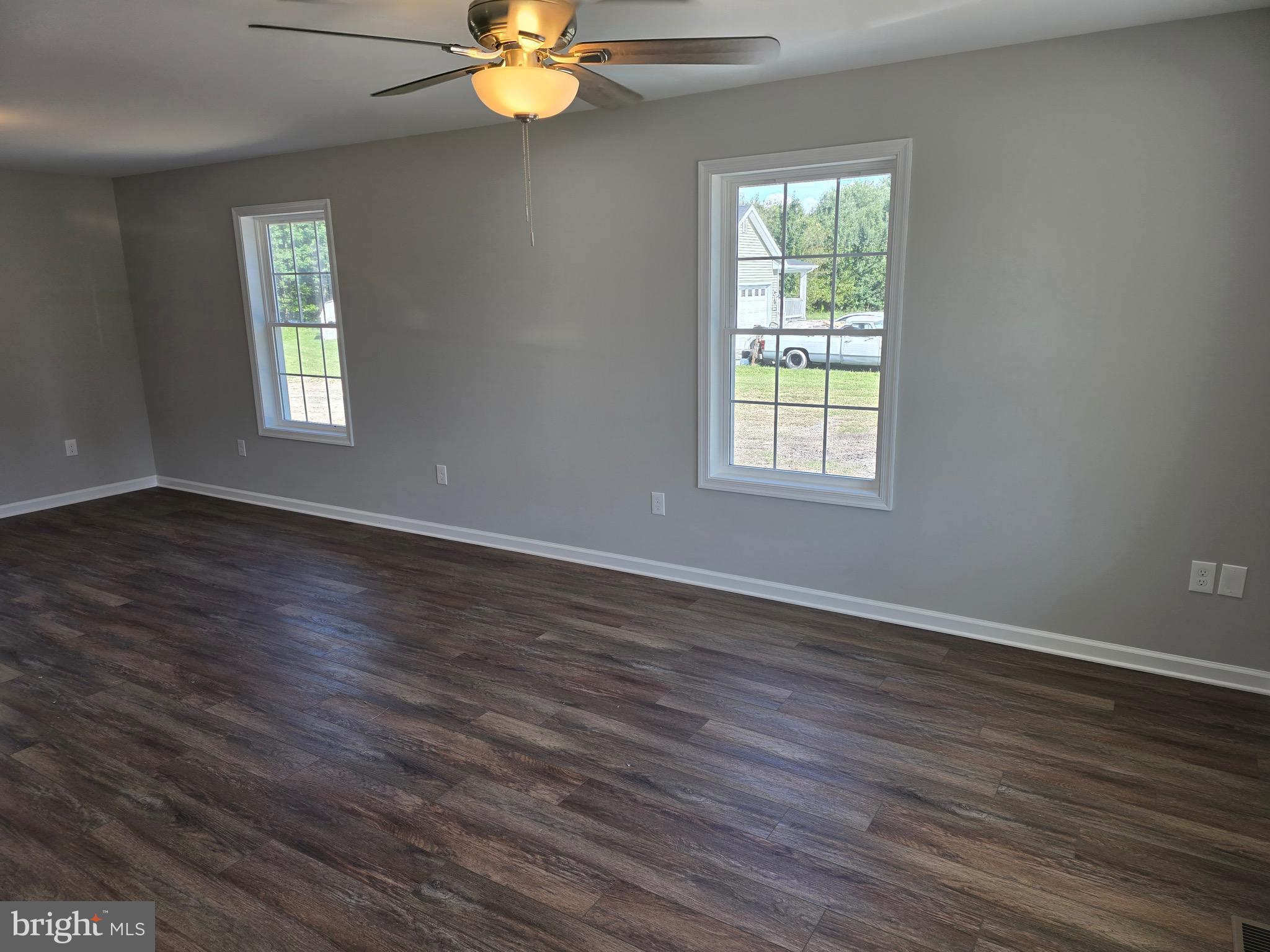 7457 Market Street Willards, MD 21874 - Photo 8 of 51 a view of an empty room with wooden floor and a window