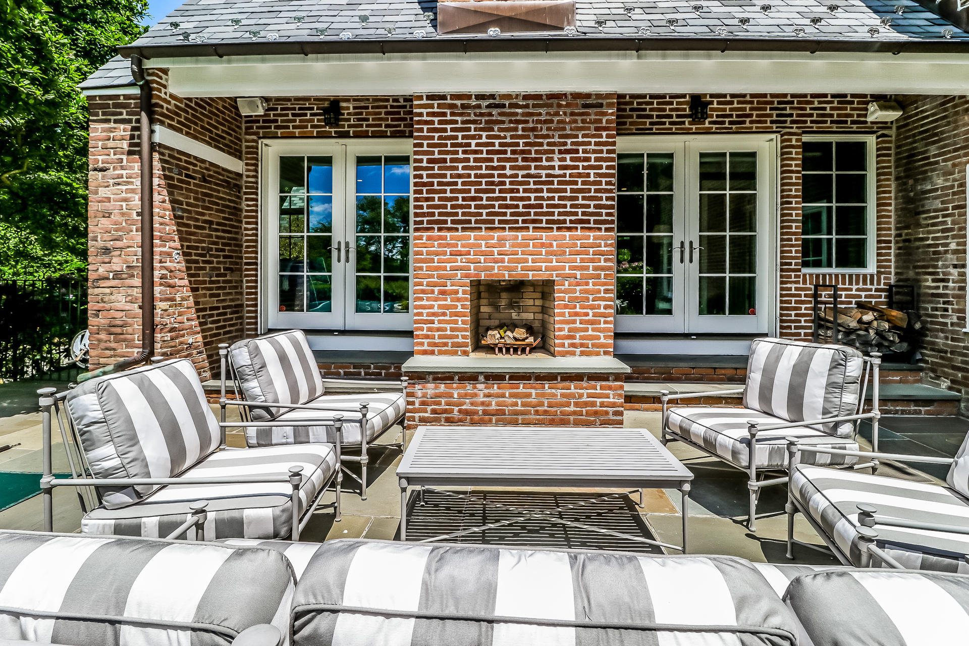 5 Hawthorne Road Darien, CT 06820 - Photo 33 of 49 a view of a patio with couches table and chairs with wooden floor