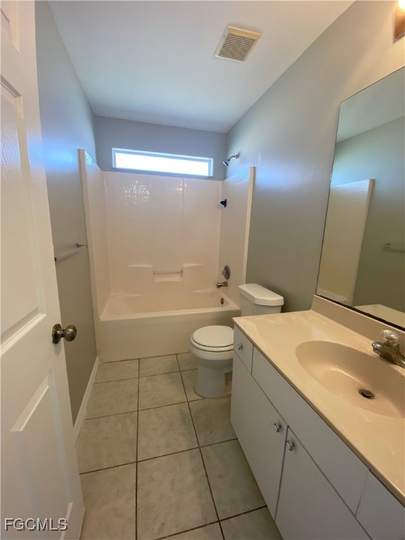4543 20th Street Southwest Lehigh Acres, FL 33973 - Photo 11 of 19 a spacious bathroom with a granite countertop sink a toilet and shower