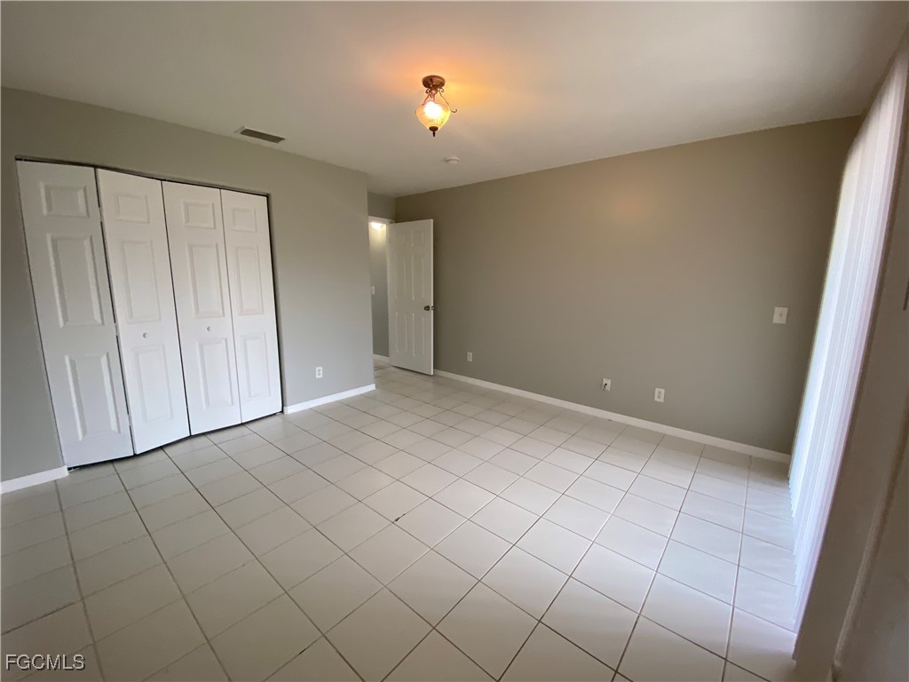 4543 20th Street Southwest Lehigh Acres, FL 33973 - Photo 12 of 19 a view of an empty room