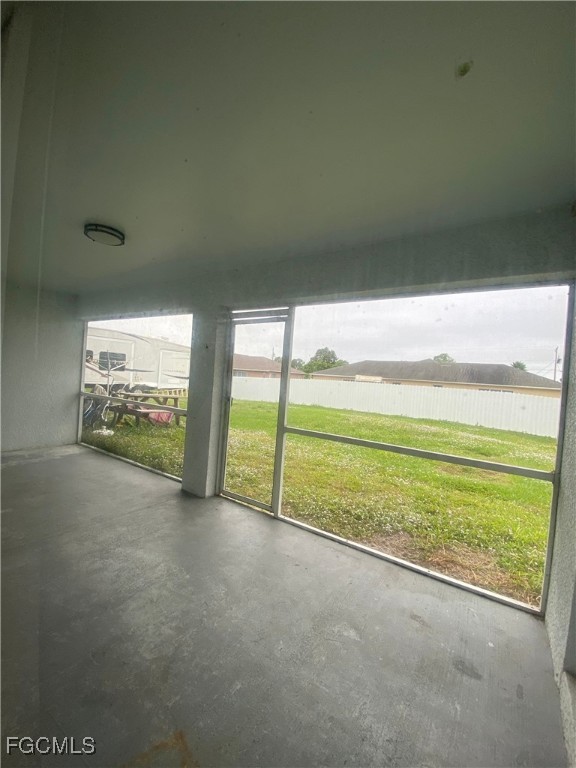 4543 20th Street Southwest Lehigh Acres, FL 33973 - Photo 14 of 19 a view of an empty room with floor to ceiling windows