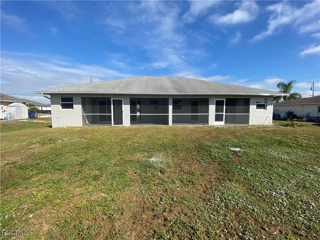 4543 20th Street Southwest Lehigh Acres, FL 33973 - Photo 17 of 19 a house view with a garden space