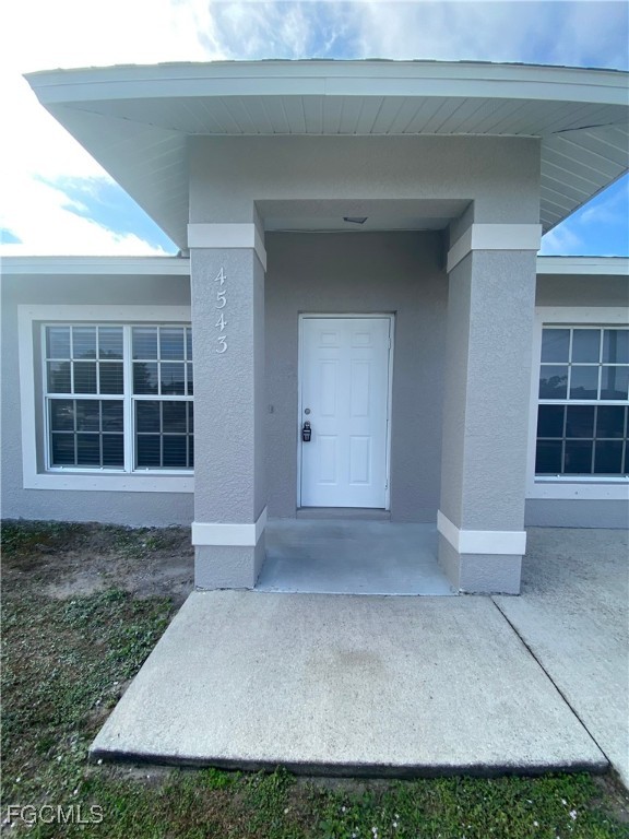 4543 20th Street Southwest Lehigh Acres, FL 33973 - Photo 19 of 19 a view of front door