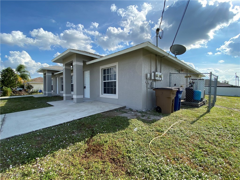 4543 20th Street Southwest Lehigh Acres, FL 33973 - Photo 3 of 19 a house view with a garden space