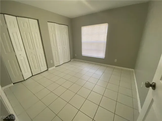 an empty room with mirror