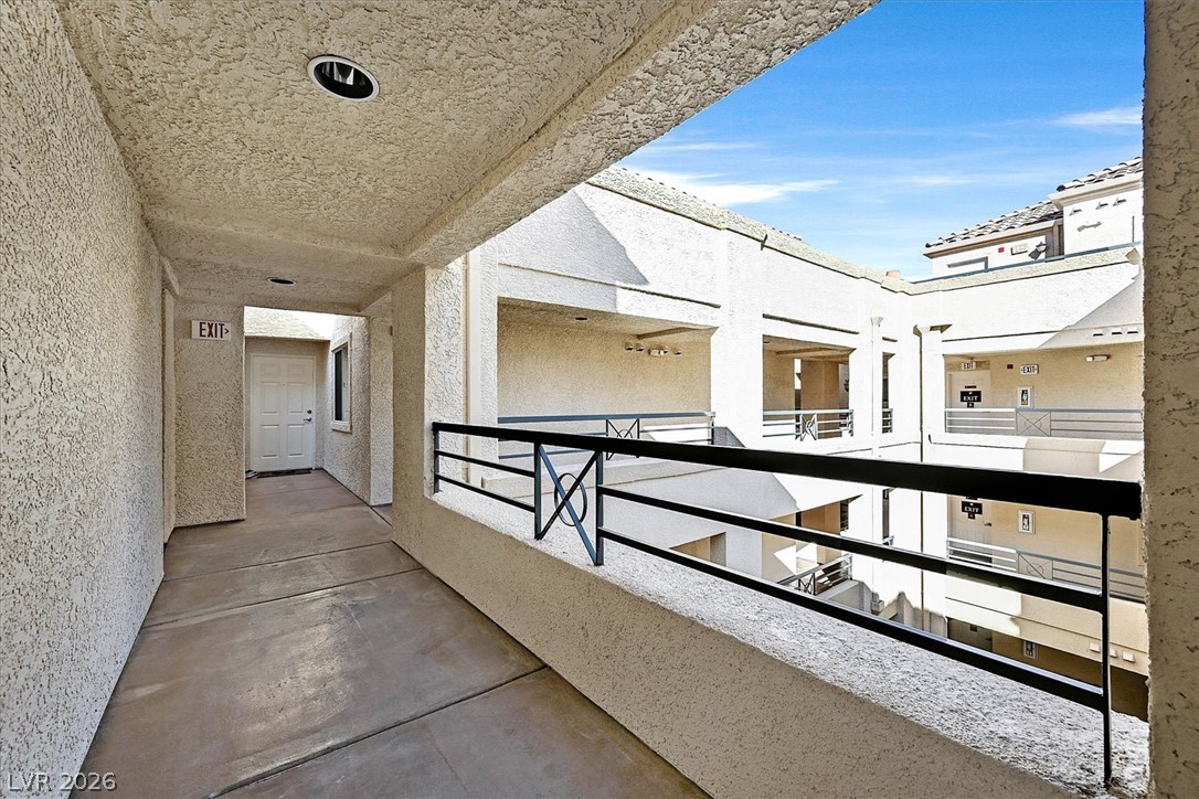 220 East Flamingo Road, Unit 305 Las Vegas, NV 89169 - Photo 15 of 26 A well-maintained common hallway offers easy access to individual units within this multi-level building.