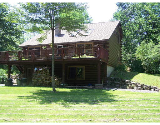 52 Island Pond Road, Unit R 109 Derry, NH 03038 - Photo 1 of 1 a view of a house with a yard and plants