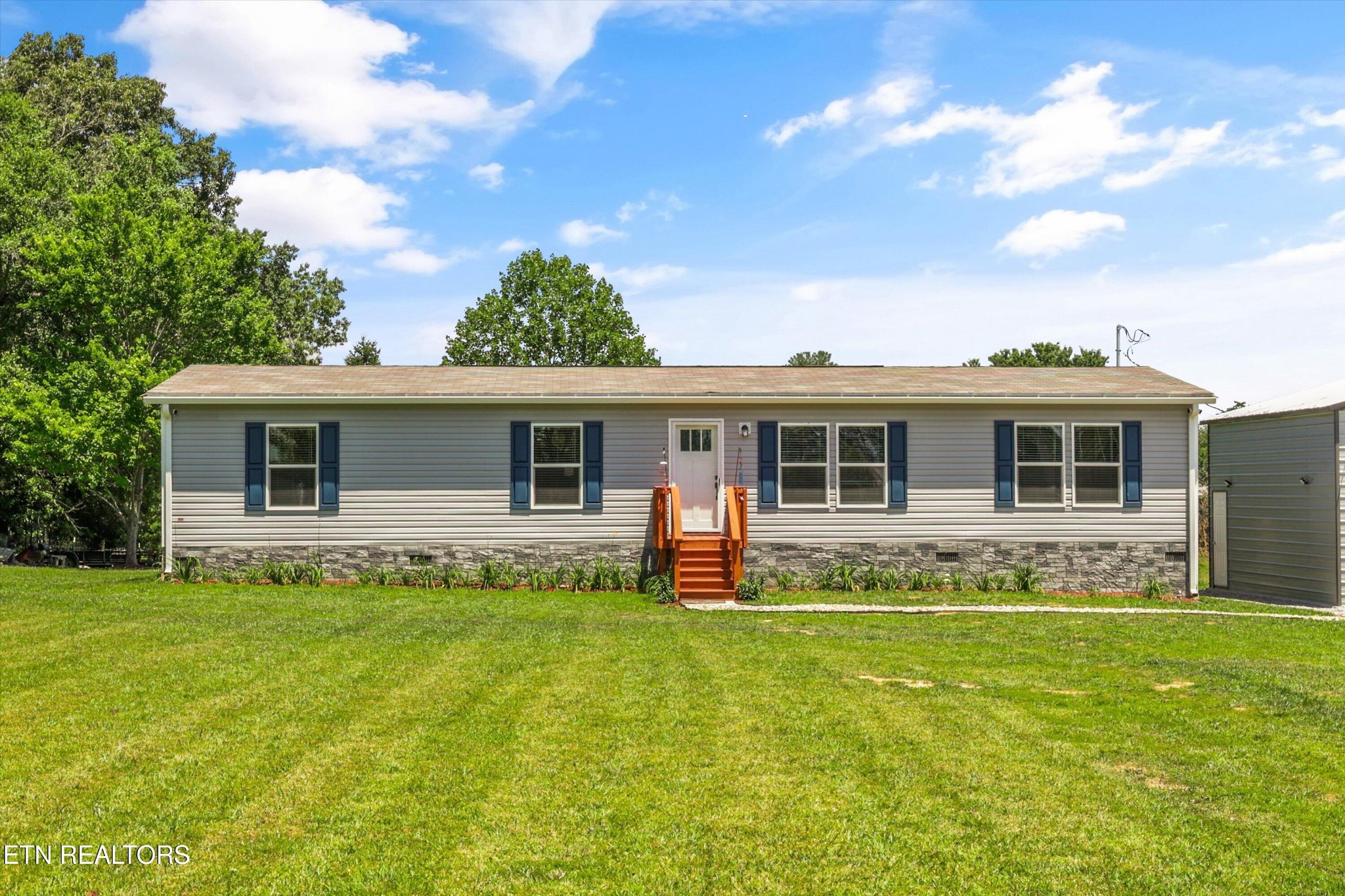 158 Frankfort Road Lancing, TN 37770 - Photo 3 of 46 a front view of house with yard and green space