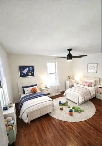 a bedroom with bed and a window