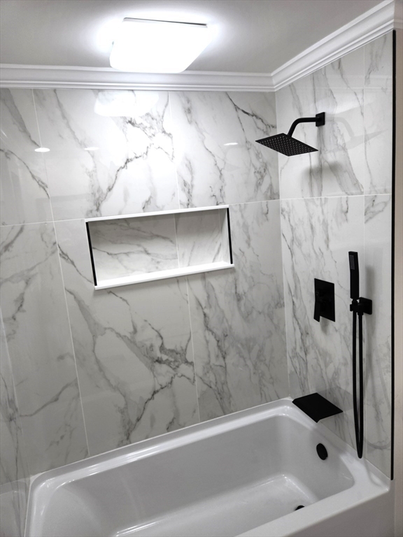 41 Bridgeport Street Worcester, MA 01604 - Photo 29 of 37 a bathroom with a bathtub and shower