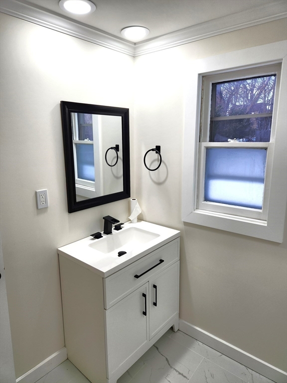 41 Bridgeport Street Worcester, MA 01604 - Photo 30 of 37 a bathroom with a sink and a mirror