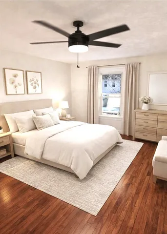 a bedroom with a large bed and a large window