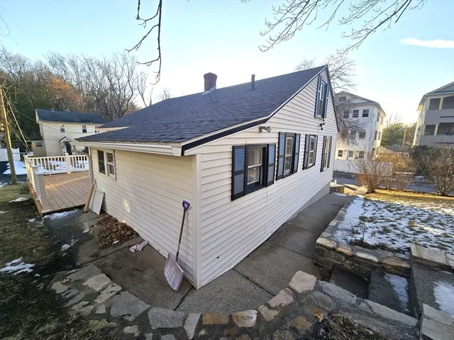 a aerial view of a house with a yard