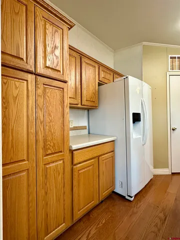 a white refrigerator freezer sitting in a kitchen