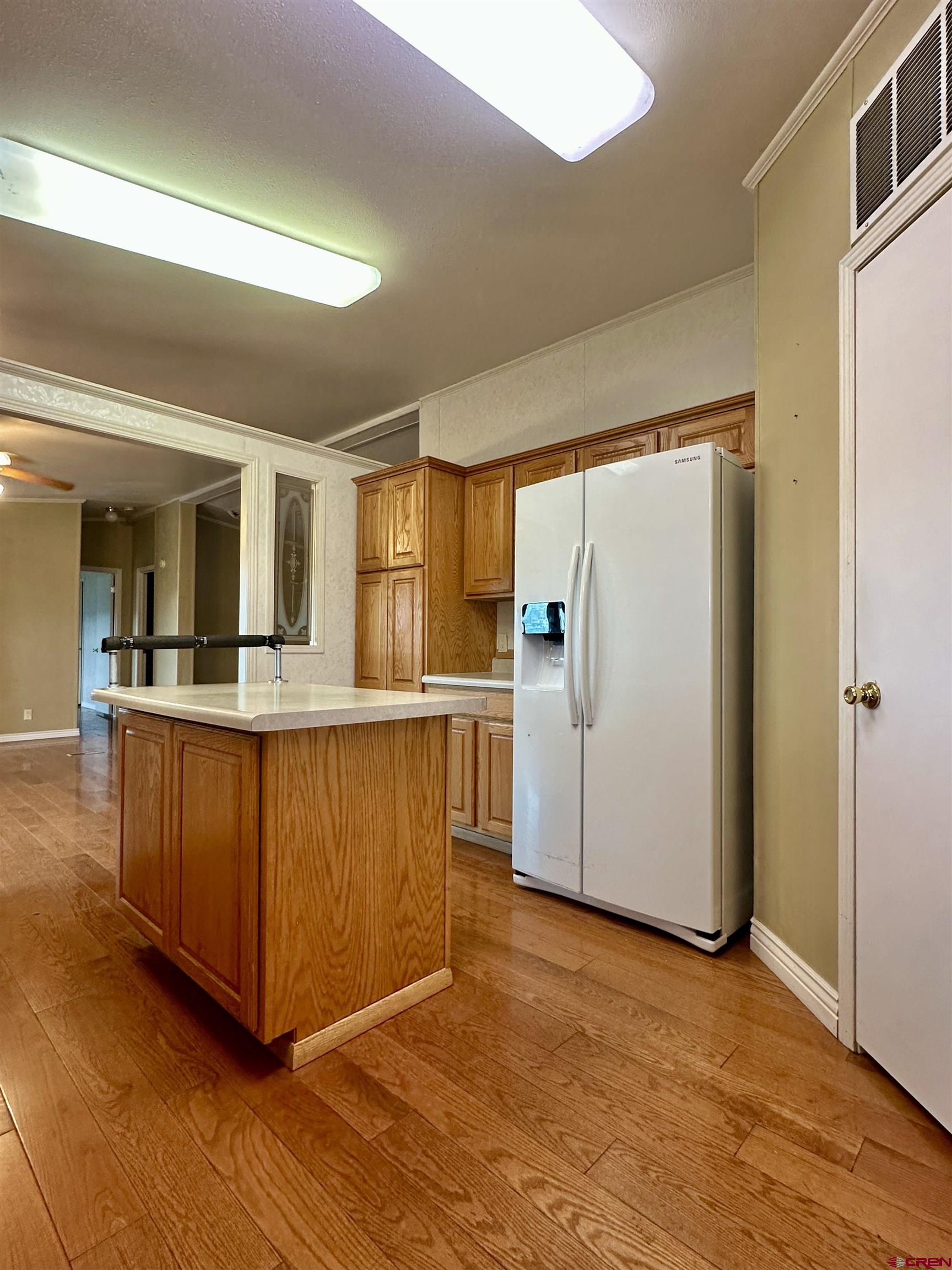 9427 2100th Road Austin, CO 81410 - Photo 14 of 42 a kitchen with stainless steel appliances granite countertop a refrigerator and a stove top oven