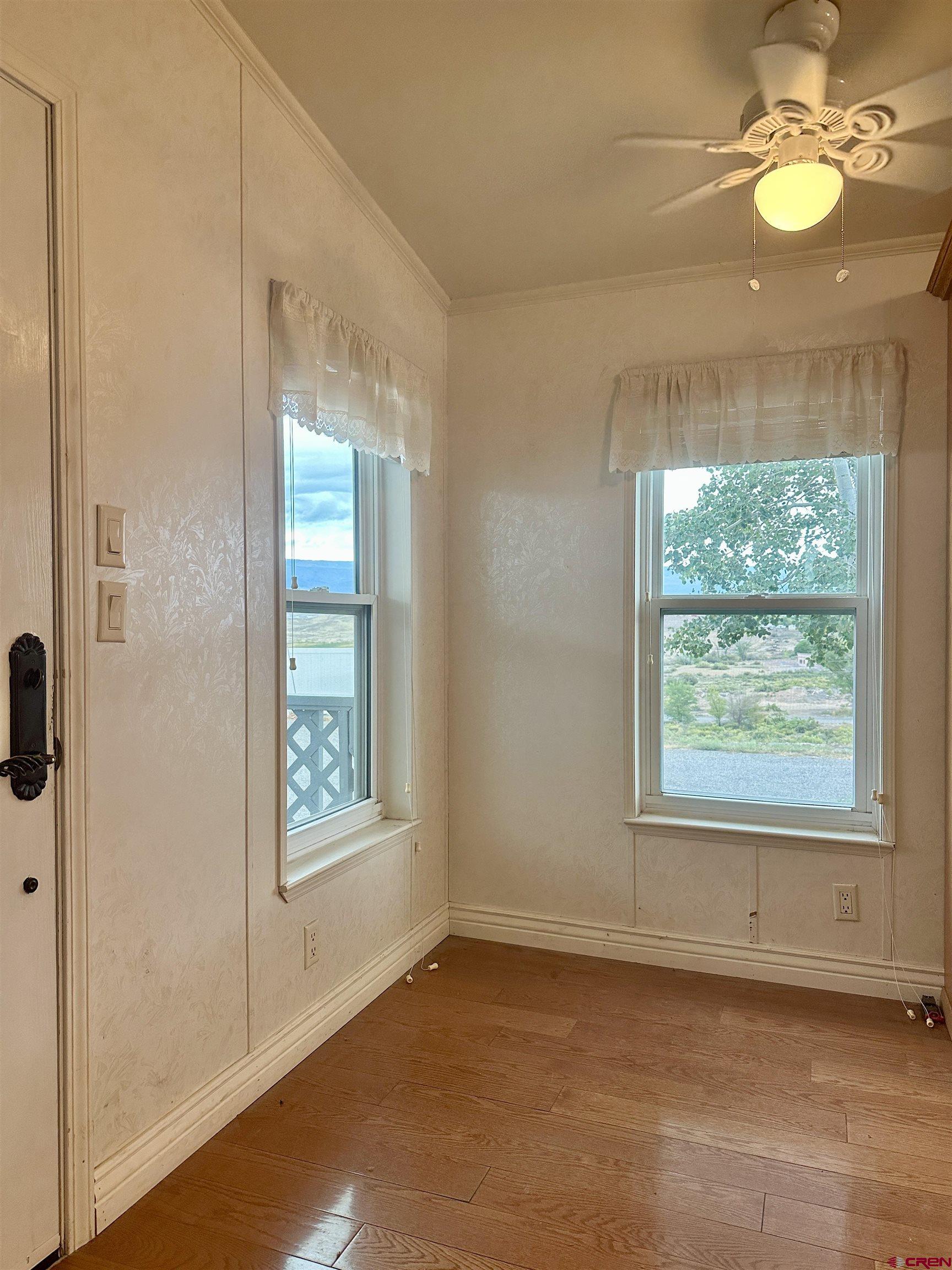 9427 2100th Road Austin, CO 81410 - Photo 20 of 42 an empty room with windows and entrance
