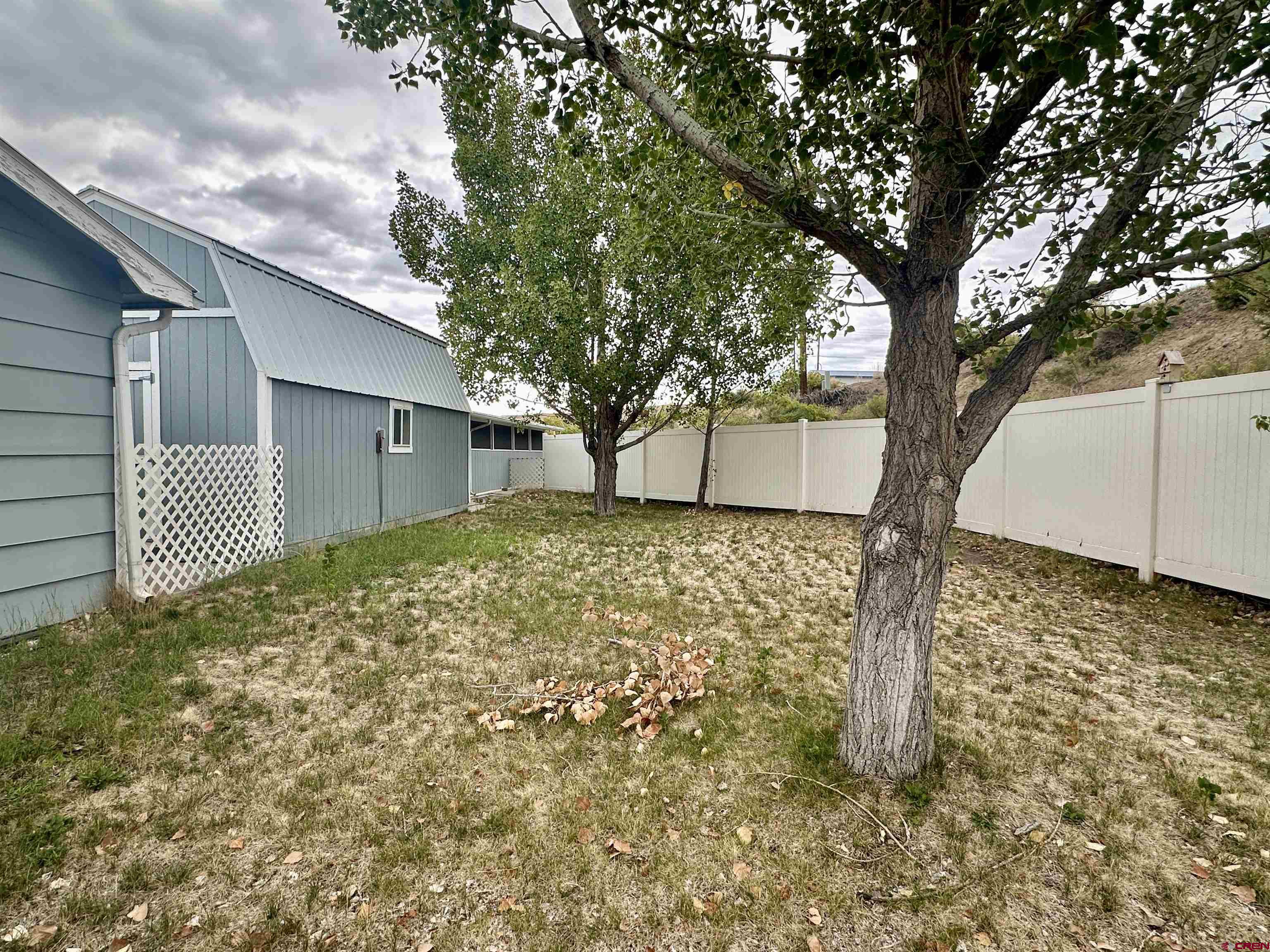9427 2100th Road Austin, CO 81410 - Photo 33 of 42 a house with trees in front of it