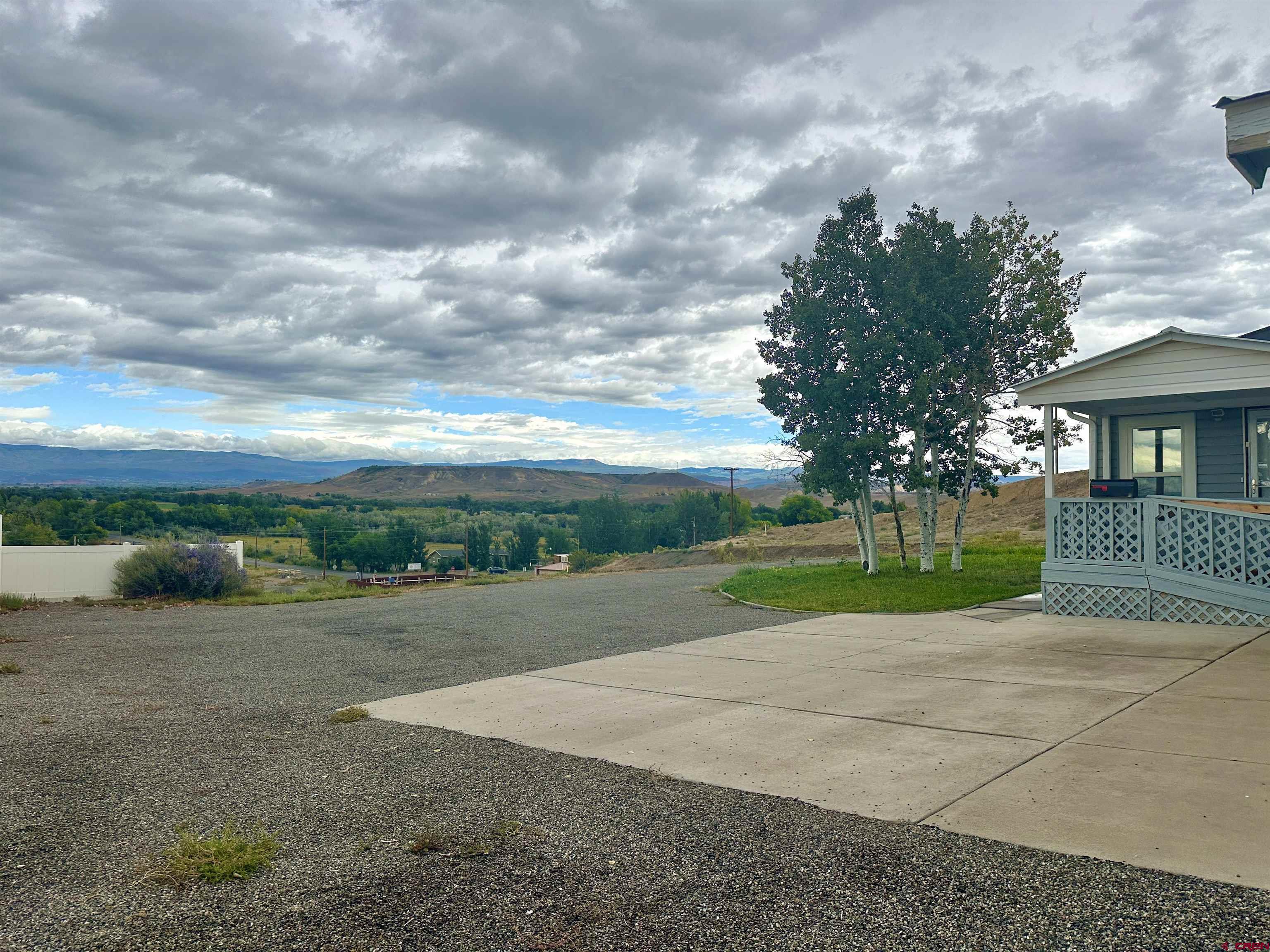 9427 2100th Road Austin, CO 81410 - Photo 42 of 42 a view of a park with large trees and wooden fence