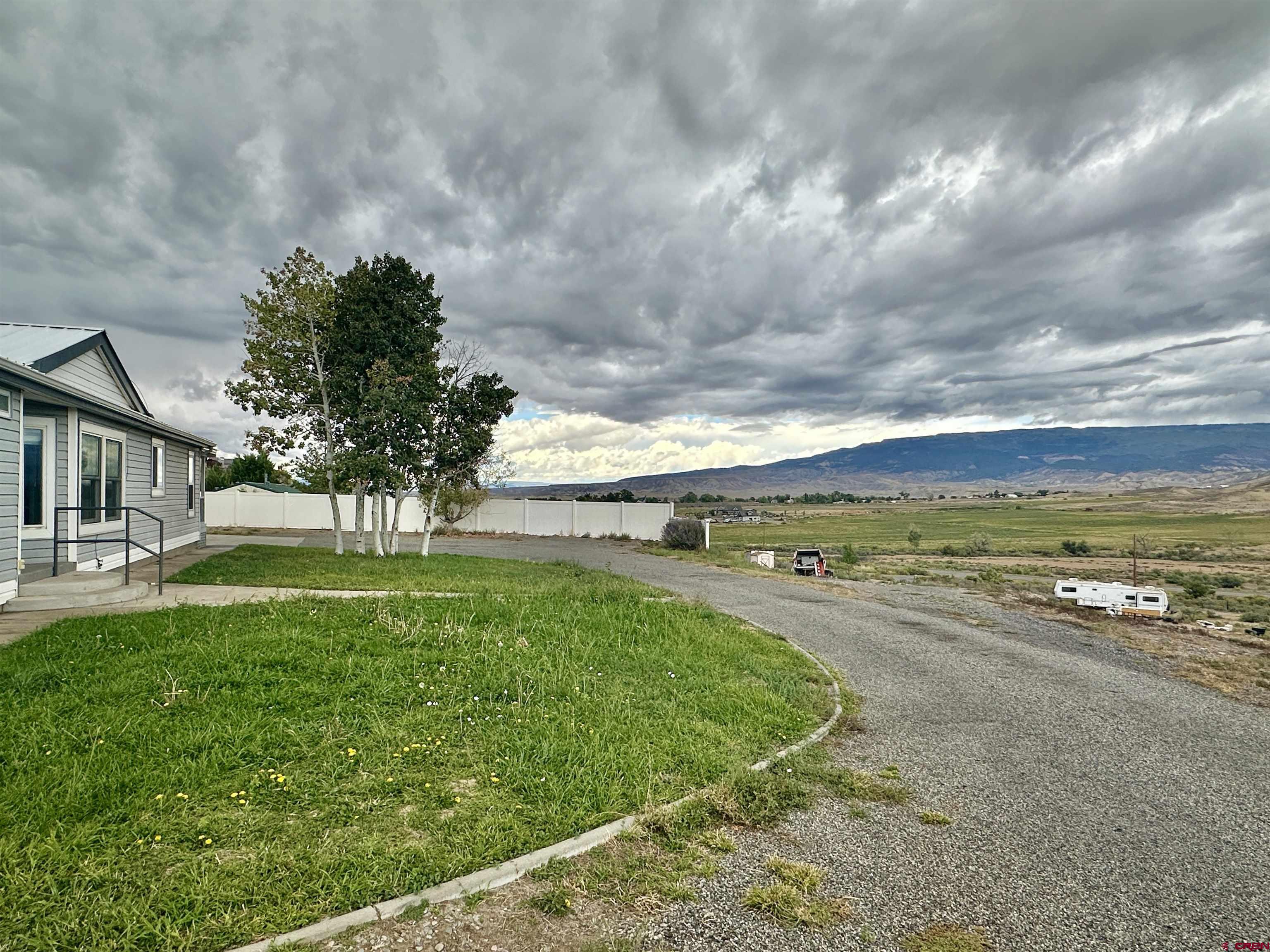 9427 2100th Road Austin, CO 81410 - Photo 5 of 42 a view of a terrace with yard
