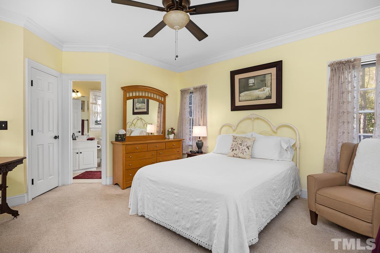 301 Medoc Lane Raleigh, NC 27615 - Photo 14 of 55 a bedroom with a bed and a couch
