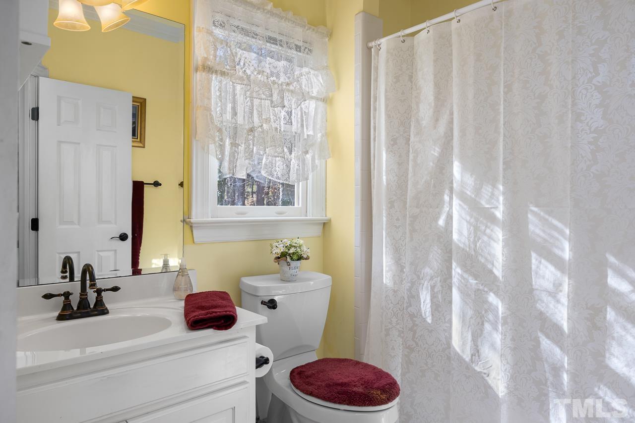 301 Medoc Lane Raleigh, NC 27615 - Photo 15 of 55 a bathroom with a sink toilet and shower