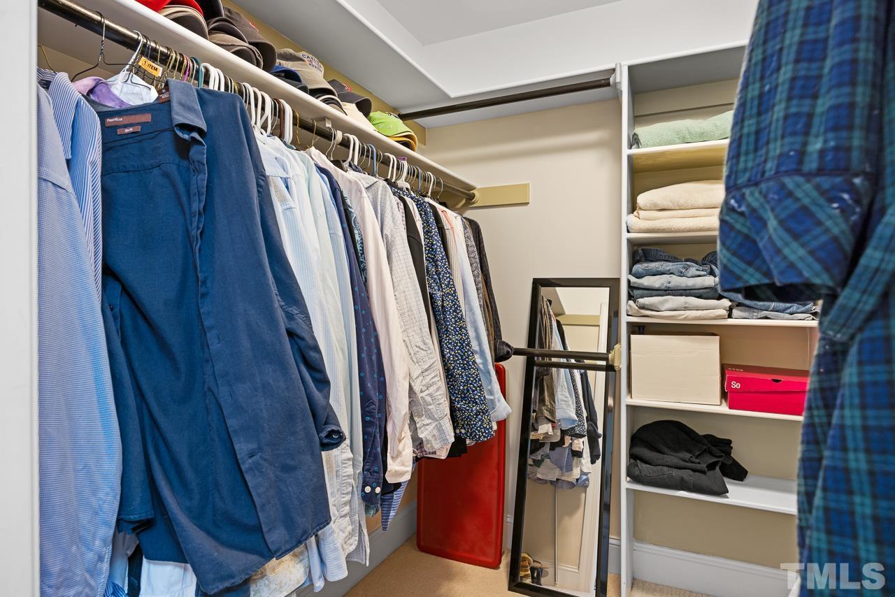 301 Medoc Lane Raleigh, NC 27615 - Photo 21 of 55 a view of walk in closet with clothes and shoes