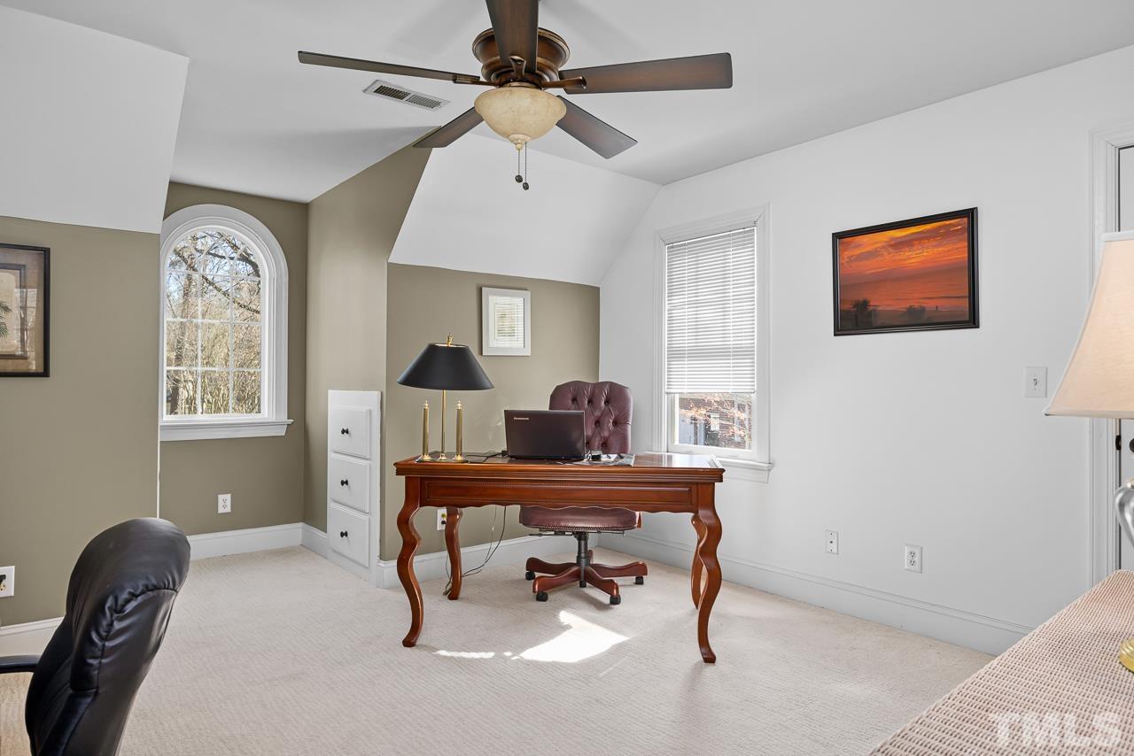 301 Medoc Lane Raleigh, NC 27615 - Photo 23 of 55 a view of a workspace with furniture and a window