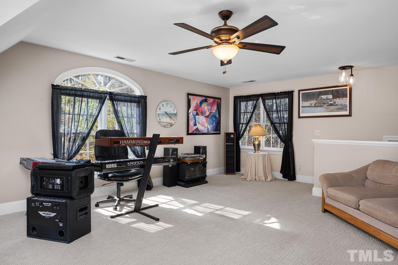 301 Medoc Lane Raleigh, NC 27615 - Photo 25 of 55 a view of a livingroom with workspace and a window