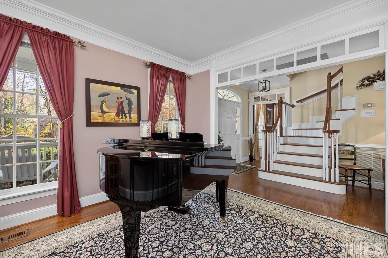 301 Medoc Lane Raleigh, NC 27615 - Photo 4 of 55 a view of entryway with wooden floor