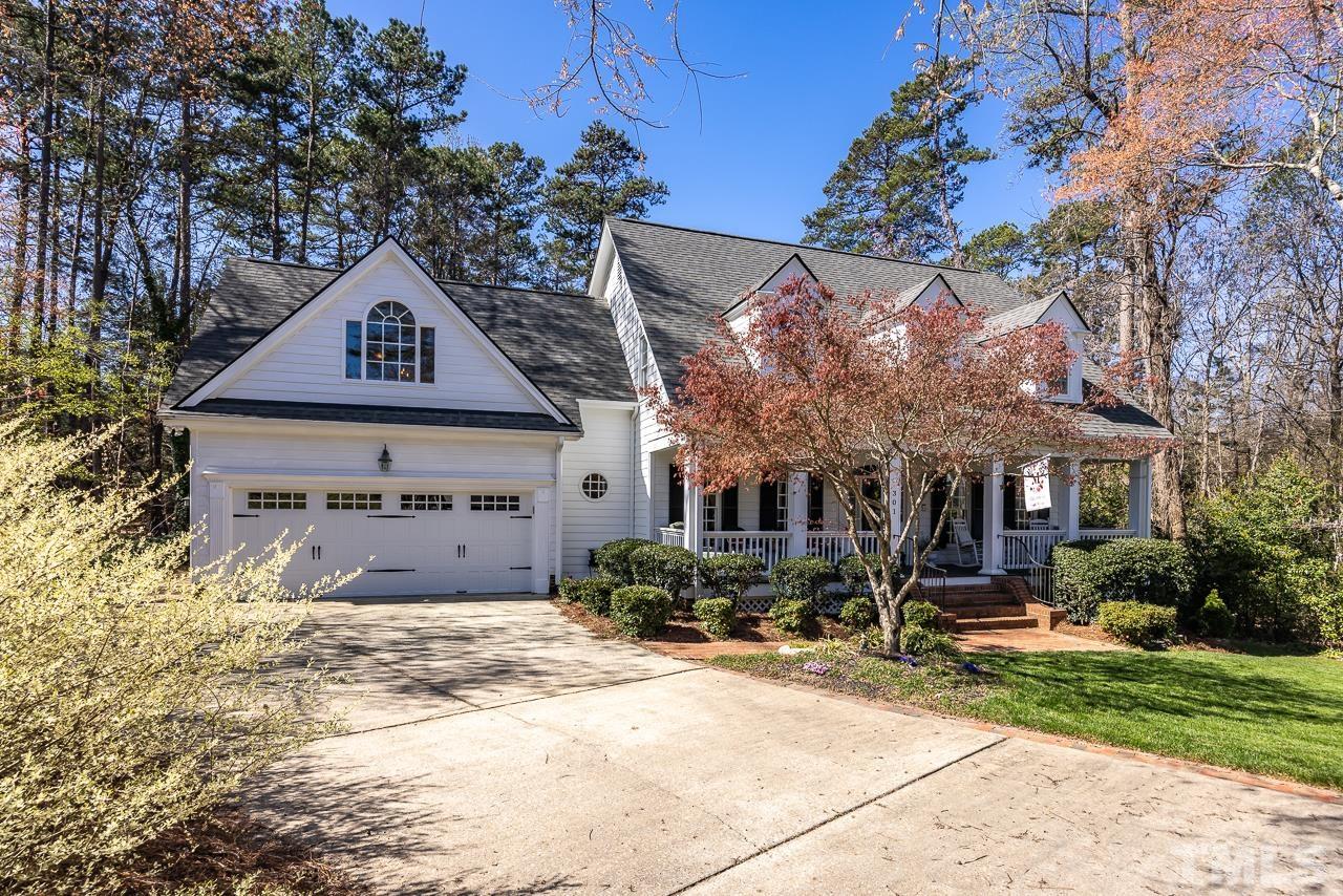 301 Medoc Lane Raleigh, NC 27615 - Photo 54 of 55 a front view of a house with a yard and garage