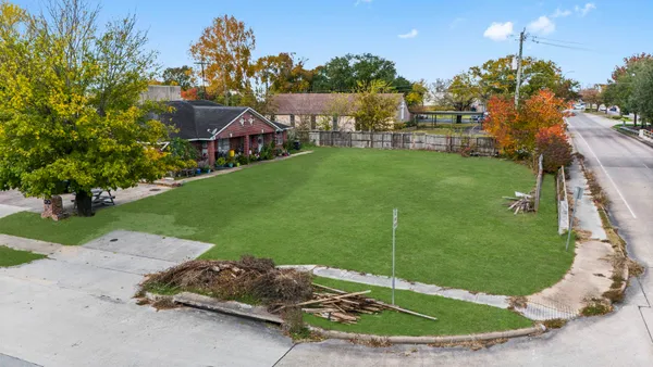 an aerial view of residential building with parking space