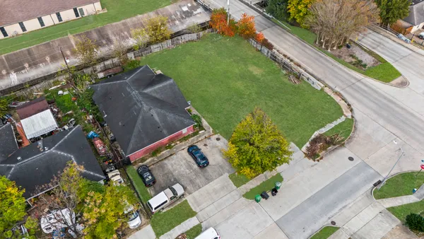 an aerial view of residential houses with outdoor space