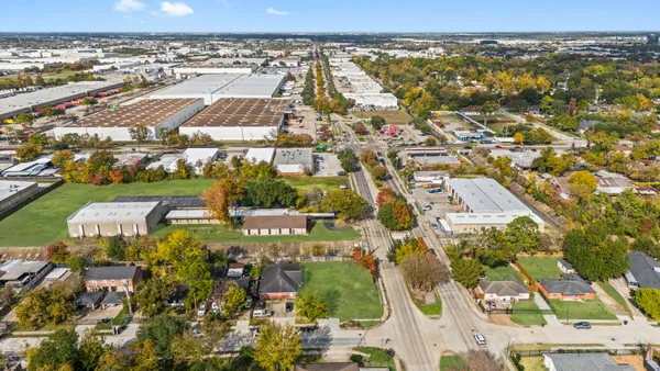an aerial view of houses with yard
