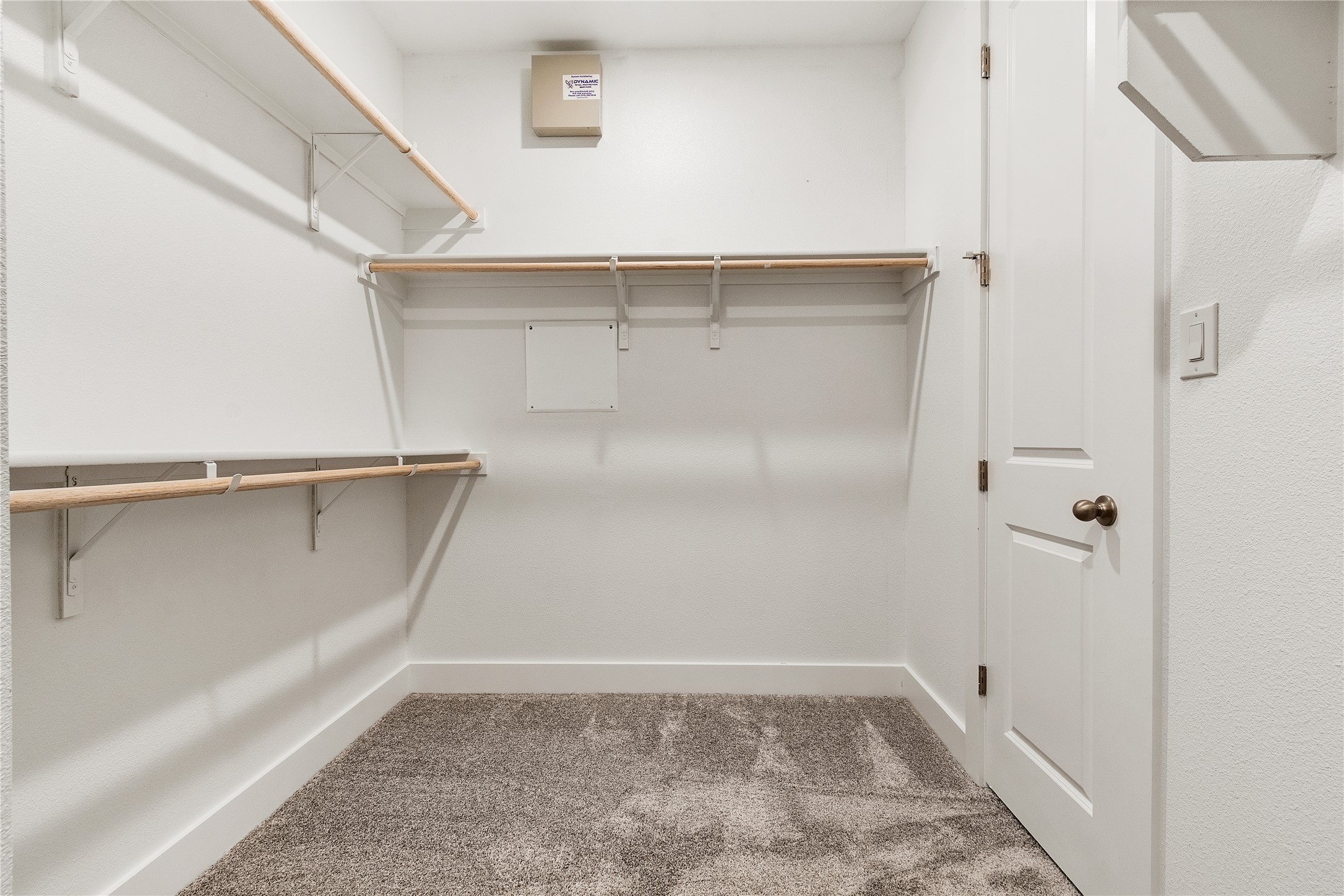 8500 Red Bottle Brush Road Lago Vista, TX 78645 - Photo 21 of 33 Functional and tidy, this walk-in closet offers ample storage with built-in shelving and hanging rods.