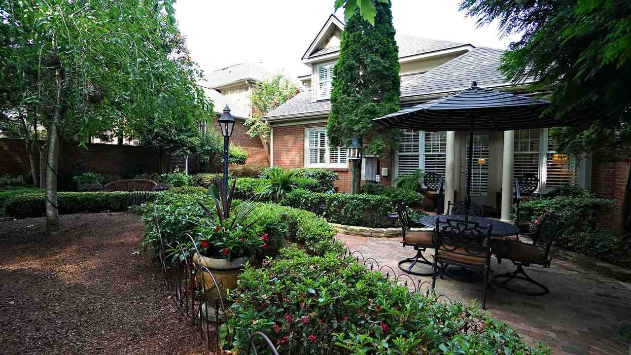 1900 Torrington Street Raleigh, NC 27615 - Photo 24 of 30 One of two private patio areas. Brick wall surround for ultimate privacy and noise buffer. Your own private oasis in the heart of Raleigh Patio