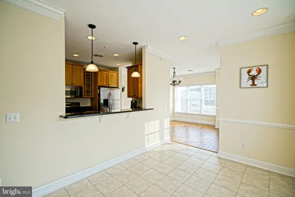 a kitchen with stainless steel appliances a refrigerator and a sink
