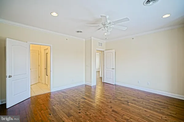 a spacious bathroom with a granite countertop sink a mirror a shower and a bathtub