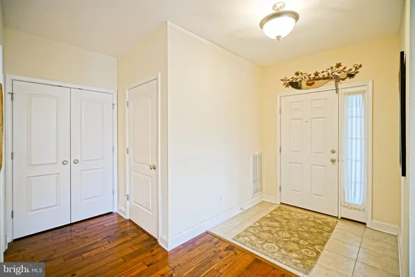a bathroom with a granite countertop shower a mirror and a sink